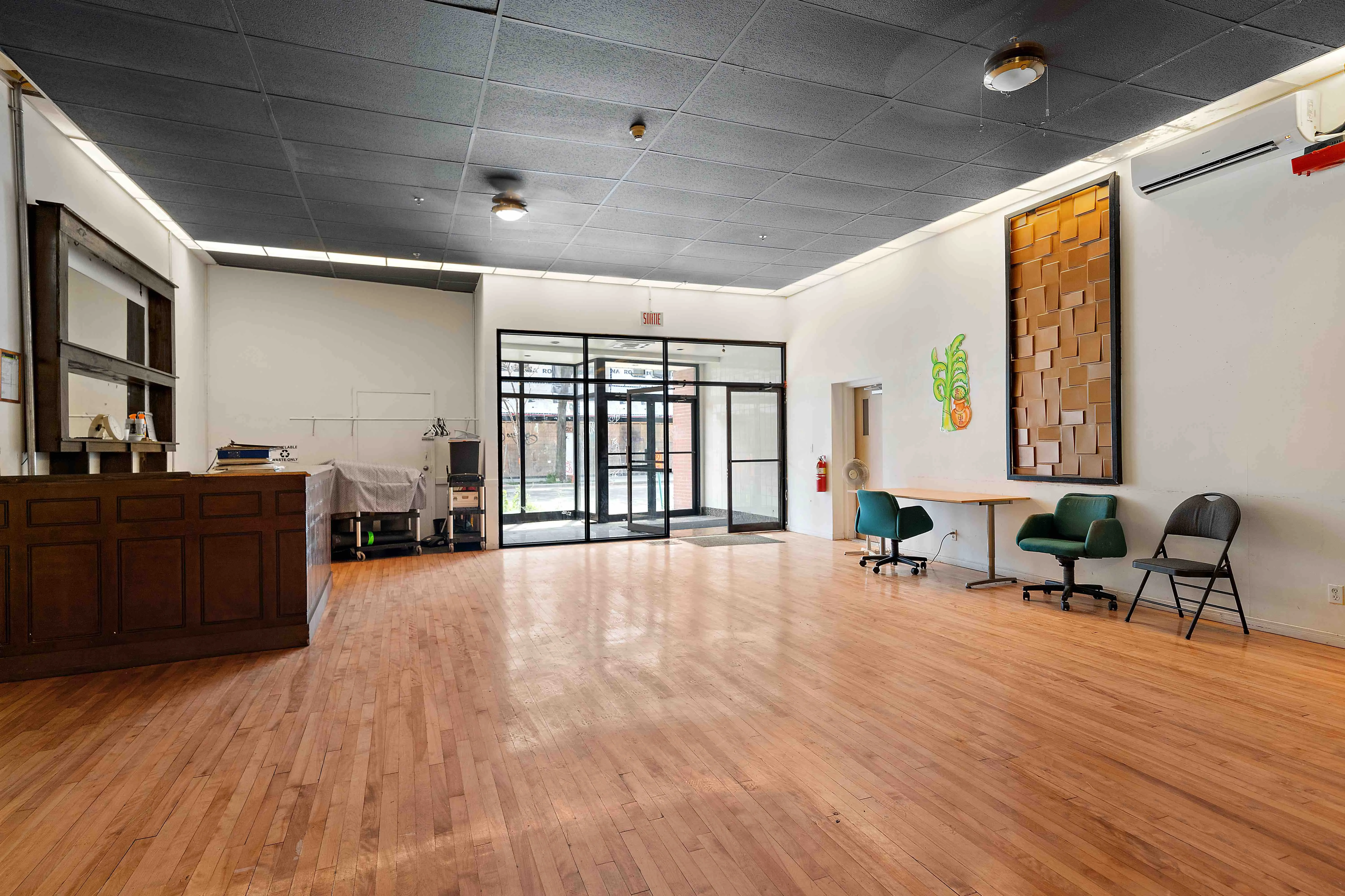 Ground-floor retail unit with wood floors and full-height glazing