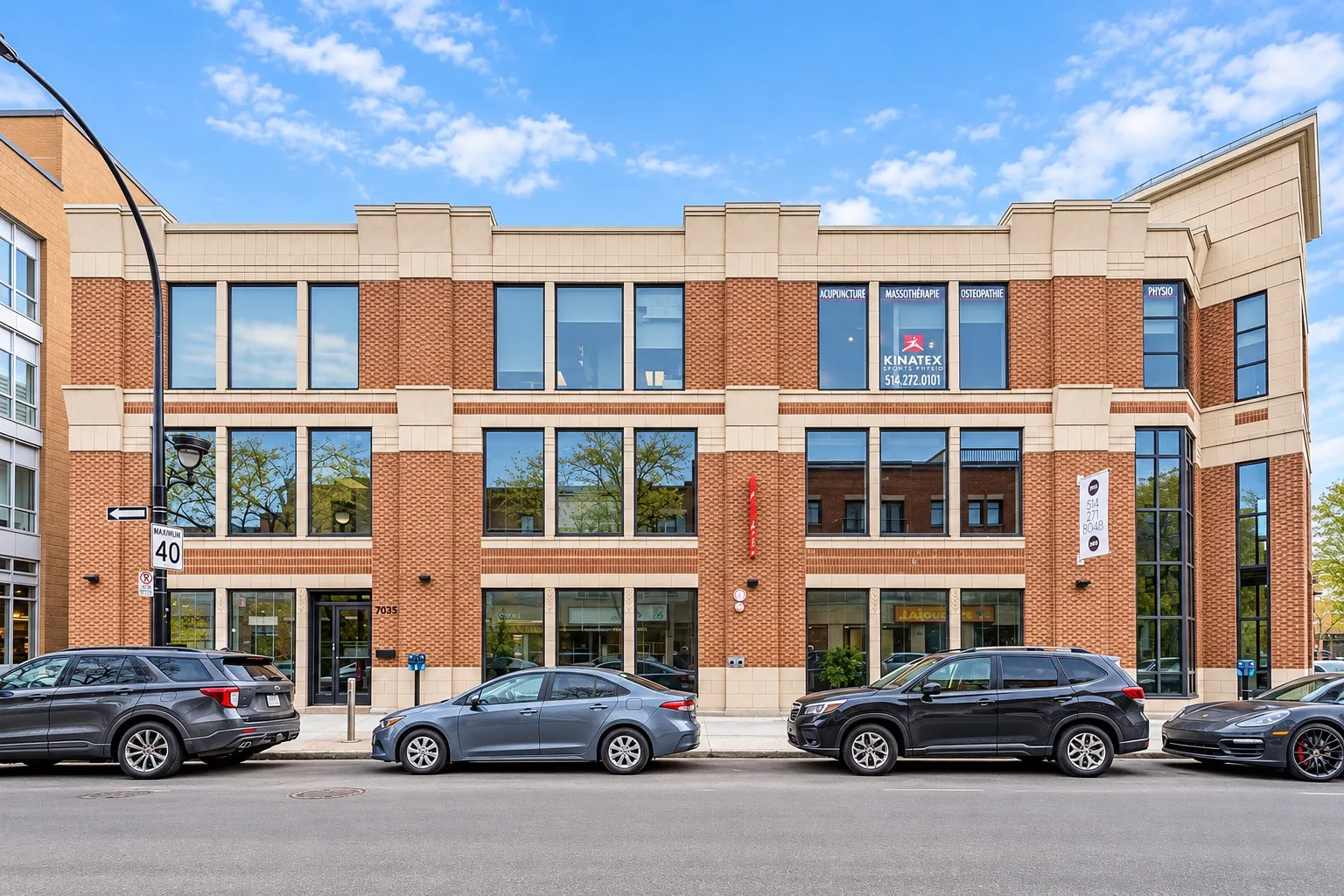 Ground-floor retail and the office floors above, seen straight on