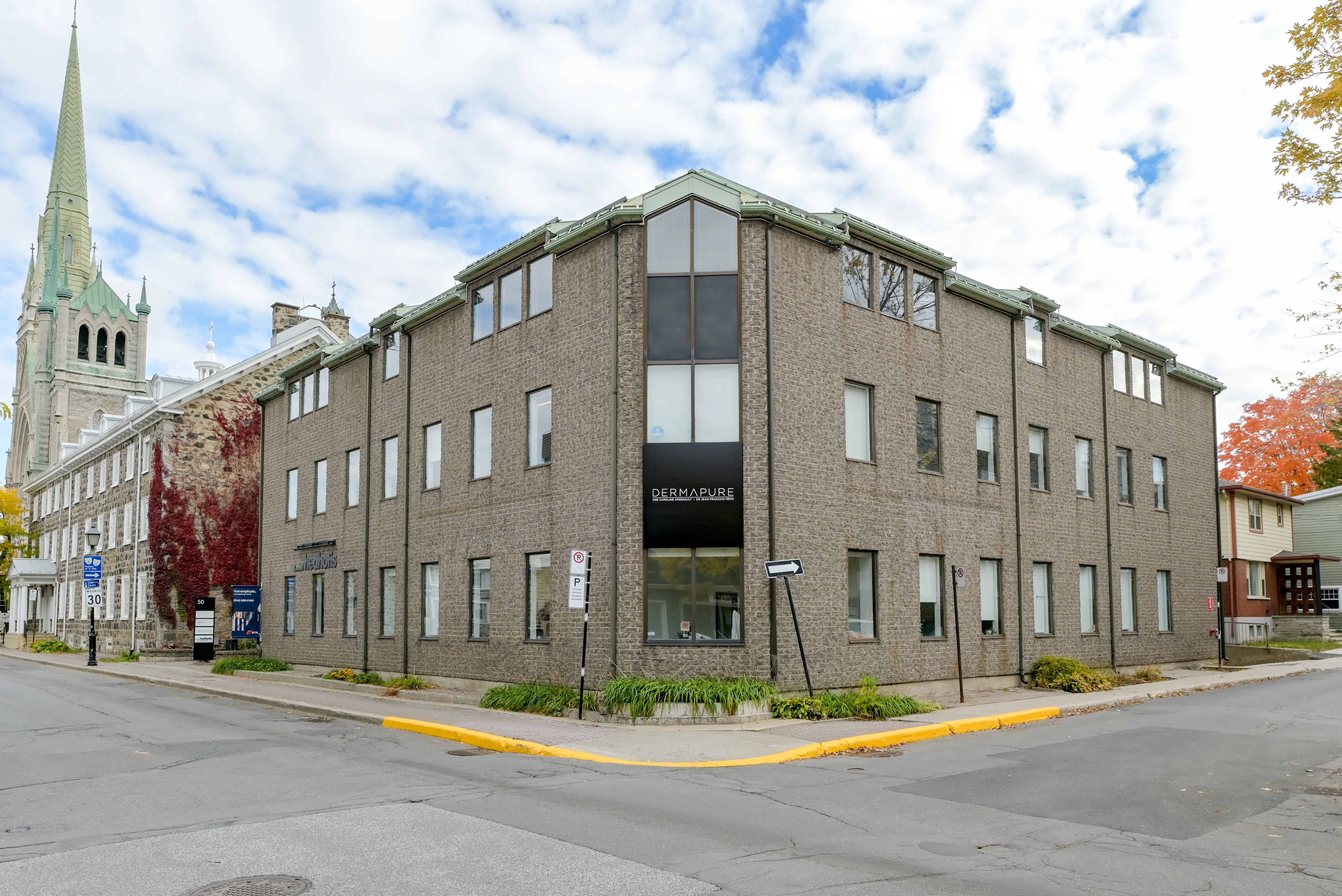 Corner elevation in Vieux-Longueuil, with the church beyond