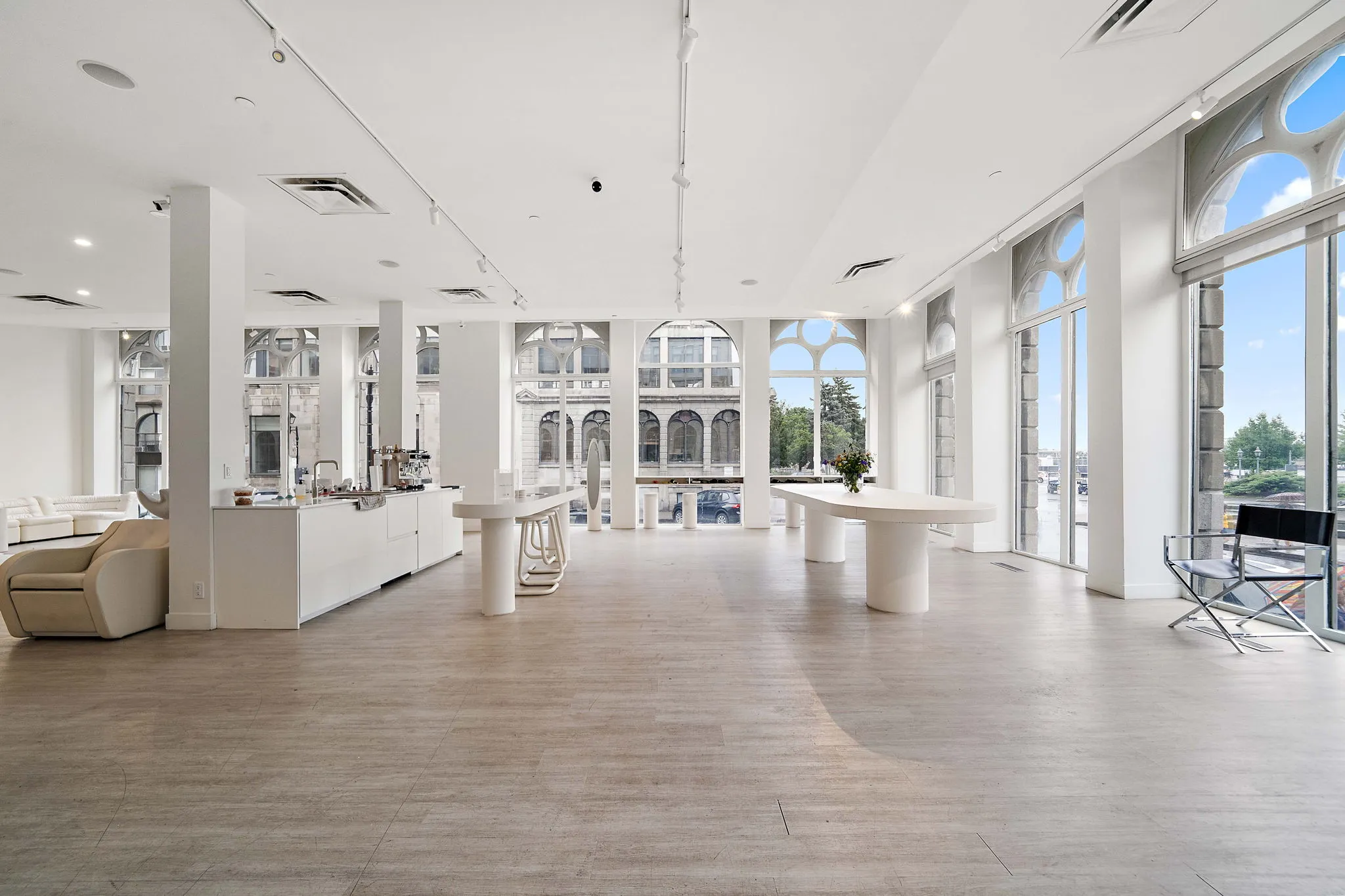 White event and showroom floor with arched windows